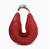 Red woven bag with a metal clasp on a white background