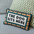 Dog Sits Here Needlepoint Pillow