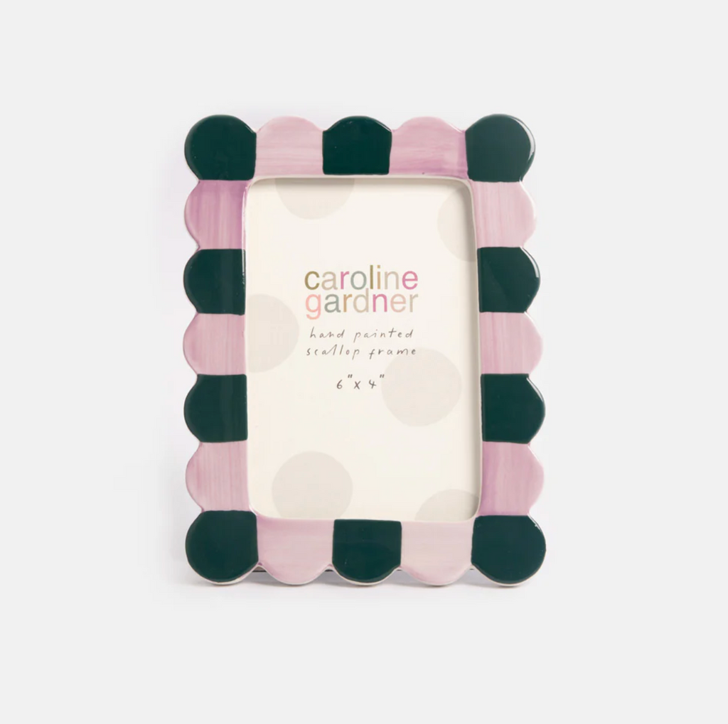 Polka dot photo frame with 'caroline gardner' branding on a white background
