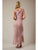 Woman wearing a pink dress with a slit on a plain background
