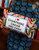Caviar & Cash Needlepoint Pillow